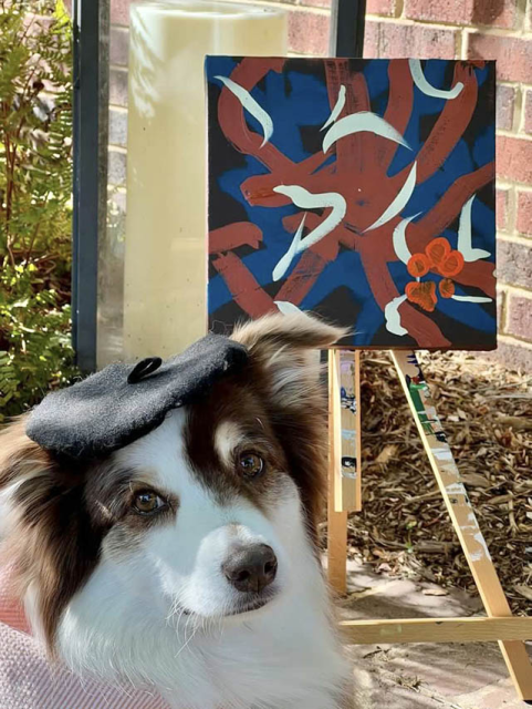 Ivy paints for the 2023 Tripawds Dog Art Auction